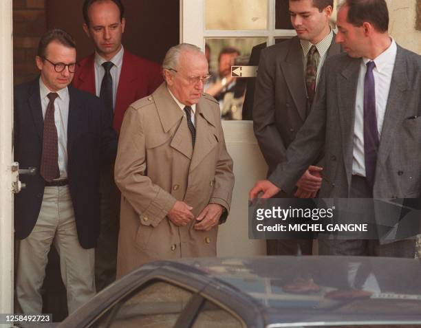 Paul Touvier , former head of Nazi's militia in war-time in Lyon, leaves the court of appeals of Versailles accompagned by his son Pierre , 29 June...