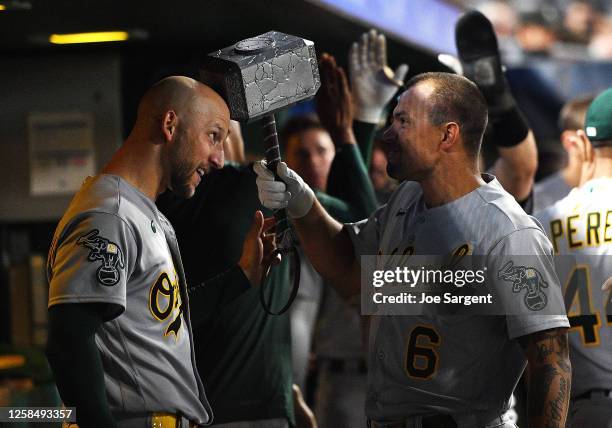 Jace Peterson of the Oakland Athletics celebrates his two-run home run with James Kaprielian during the eighth inning against the Pittsburgh Pirates...