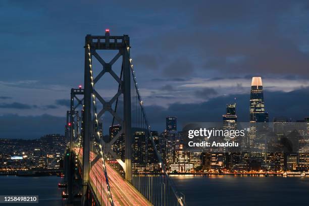 City view with San Francisco-Oakland Bay Bridge is seen during cloudy weather and sunset in Treasure Island of San Francisco, California, United...