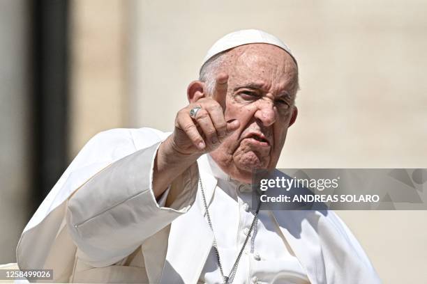 Pope Francis gestures as he leaves in the popemobile car at the end of the weekly general audience on June 7, 2023 at St. Peter's square as in The...
