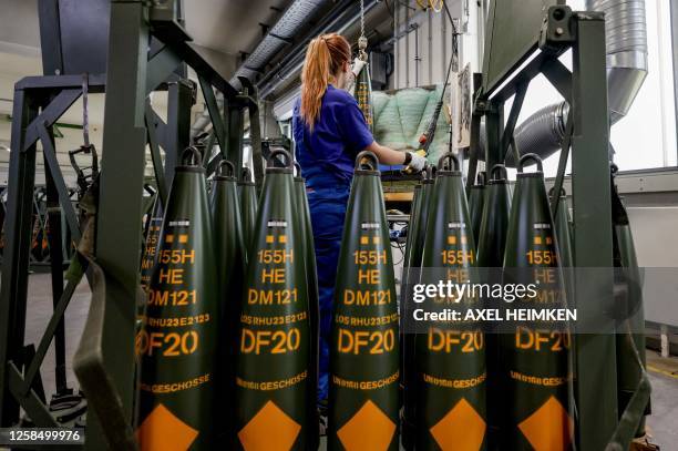 Technician of German armaments company and automotive supplier Rheinmetall works on 155mm ammunition that will be delivered to Ukrainian Forces for...