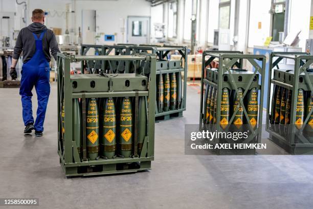 Technician of German armaments company and automotive supplier Rheinmetall works on 155mm ammunition that will be delivered to Ukrainian Forces for...