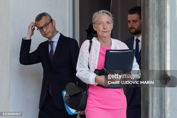 French Prime Minister Elisabeth Borne and Elysee Palace General Secretary Alexis Kohler leave after a weekly cabinet meeting at the Elysee Palace in...