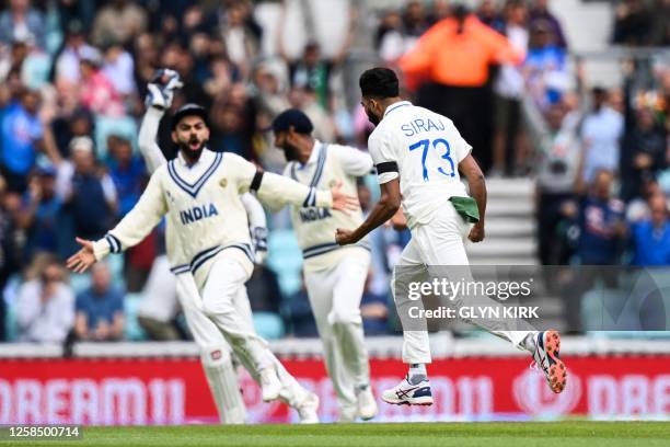 India's Mohammed Siraj celebrates with teammates after taking the wicket of Australia's Usman Khawaja during day 1 of the ICC World Test Championship...