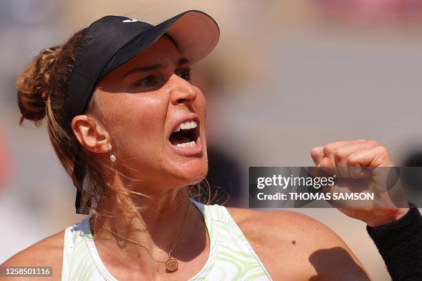 Brazil's Beatriz Haddad Maia celebrates a point against Tunisia's Ons Jabeur during their women's singles quarter final match on day eleven of the...