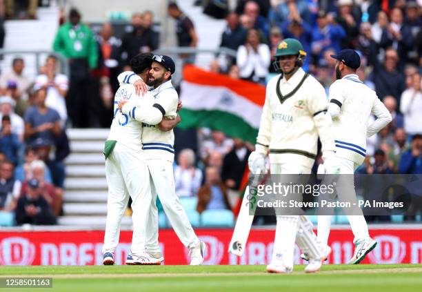 India's Mohammed Siraj celebrates after Australia's Usman Khawaja is caught off of his bowling during day one of the ICC World Test Championship...