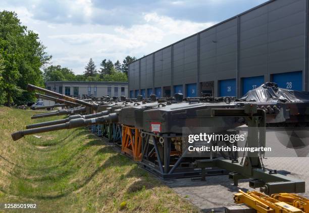 Turrets of the Leopard 2A4 battle tank, intended for delivery to the Ukraine, are stored in front of a production hall of the armaments group...