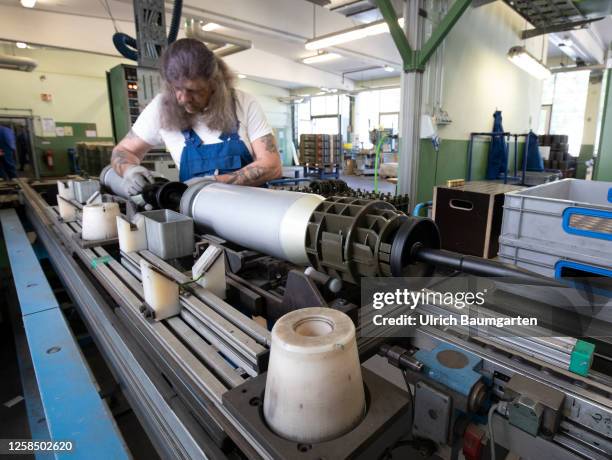 Working on the 120mm Sabot round for the Leopard 2 battle tank in a production hall of the armaments group Rheinmetall AG on June 06, 2023 in...