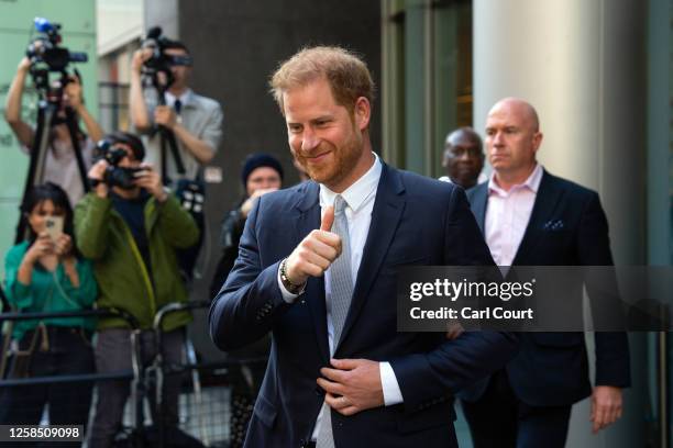 Prince Harry, Duke of Sussex, gives a thumbs up as he leaves after giving evidence at the Mirror Group Phone hacking trial at the Rolls Building at...