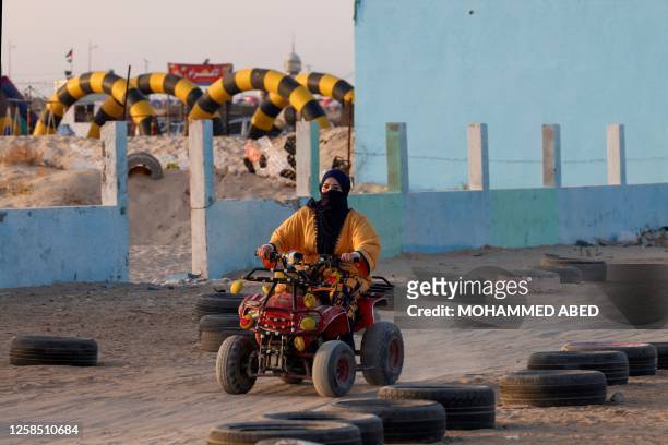 Palestinian women ride buggies at a track in Gaza city on June 7, 2023.