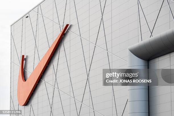 This photograph taken on June 7, 2023 shows the Nike logo on the outside of the Nike European Logistics Campus in Laakdal. Nike European Logistics...