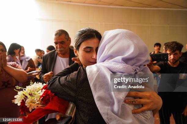 Yazidi women are welcomed by their families and the regional officials during a ceremony held at the Azadi Panorama park in Duhok, Iraq on June 07,...