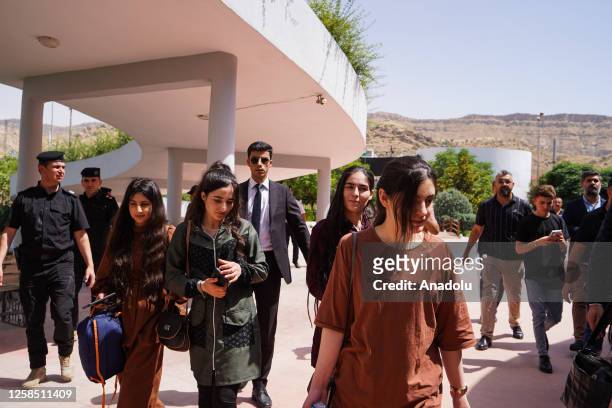 Yazidi women are welcomed by their families and the regional officials during a ceremony held at the Azadi Panorama park in Duhok, Iraq on June 07,...