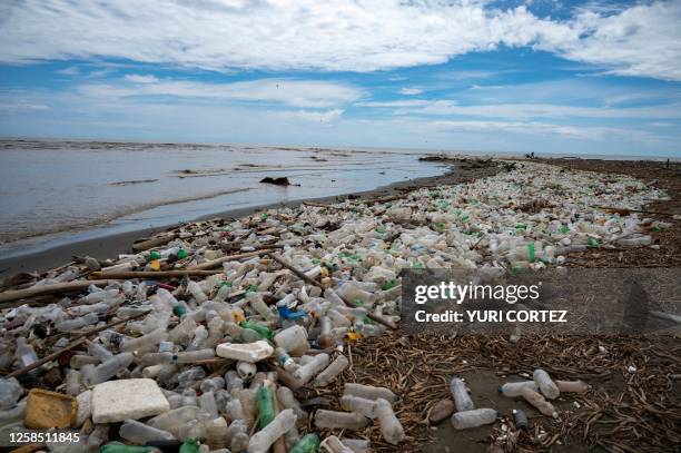 Garbage, including plastic waste, is seen at Paparo Beach in Miranda State, Venezuela, on June 6, 2023. Tons of garbage that includes hospital waste,...