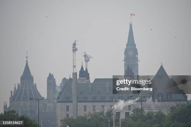 Smoke from wildfires over Parliament Hill in Ottawa, Ontario, Canada on Wednesday, June 7, 2023. Ottawa air quality health index was rated 10+ or...