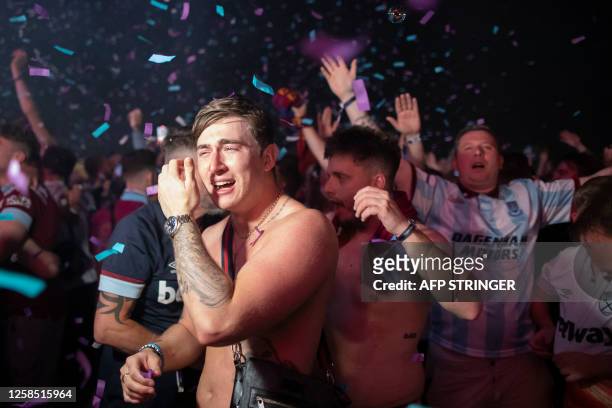 Fans of West Ham United celebrate in the fanzone at Letna after winning the UEFA Europa Conference League final football match between ACF Fiorentina...