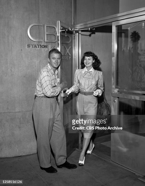 Left to right, George Fisher, KNX Radio on-air personality and Hollywood gossip columnist; with actress Ava Gardner. July 21, 1947. Hollywood, CA.