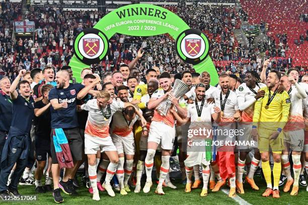 West Ham players including West Ham United's English midfielder Declan Rice celebrate with the trophy after winning the UEFA Europa Conference League...