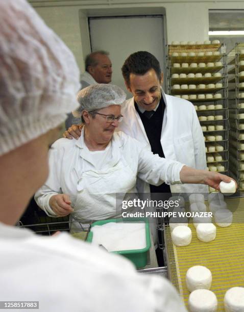 French right-wing presidential candidate Nicolas Sarkozy visits a "Crottin de Chavignol" cheese factory in Chavignol, 26 February 2007, as part of a...