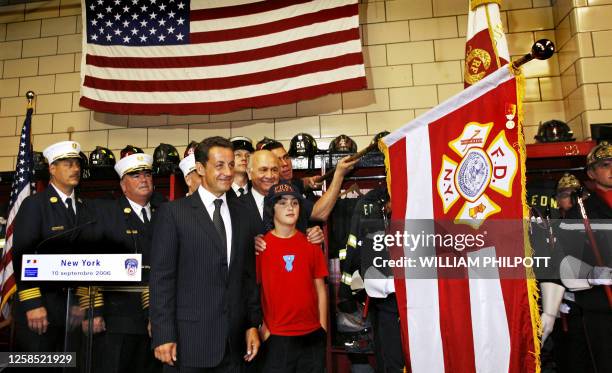 France's Interior Minister Nicolas Sarkozy presents firefighters from Engine 54, Ladder 4 with the French Medal of Honor in New York City 10...