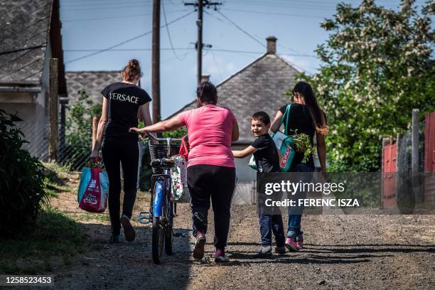 Roma family is pictured in Nagykallo, 240 km from the capital Budapest, on May 26, 2023. At 24.5 percent in April, inflation in Hungary was three...