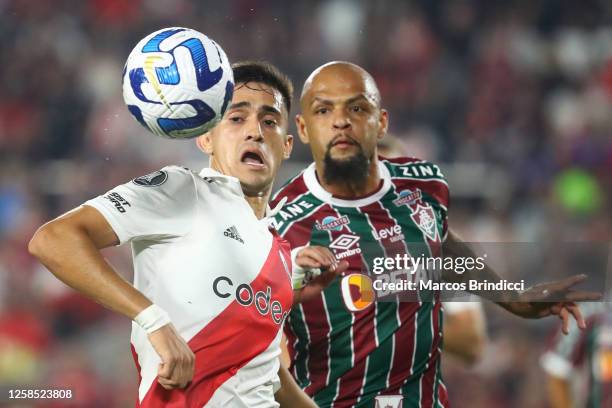 Pablo Solari of River Plate and Felipe Melo of Fluminense fight for the ball during a Copa CONMEBOL Libertadores 2023 group D match between River...
