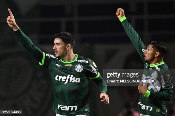 Palmeiras' Uruguayan defender Joaquin Piquerez celebrates with his teammate forward Rony after scoring a goal during the Copa Libertadores group...