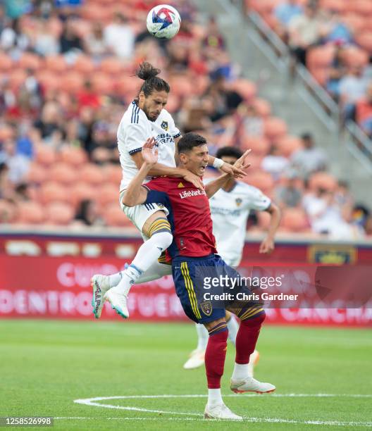 Damir Kreilach of Real Salt Lake reacts as he battles for a head ball with Jose Caceres of the Los Angeles Galaxy during the first half of the...