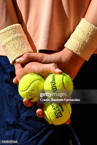 Illustration of Roland Garros official tennis match balls in the hands of a ball boy during the Day 10 of Roland Garros Tournament at Roland Garros...