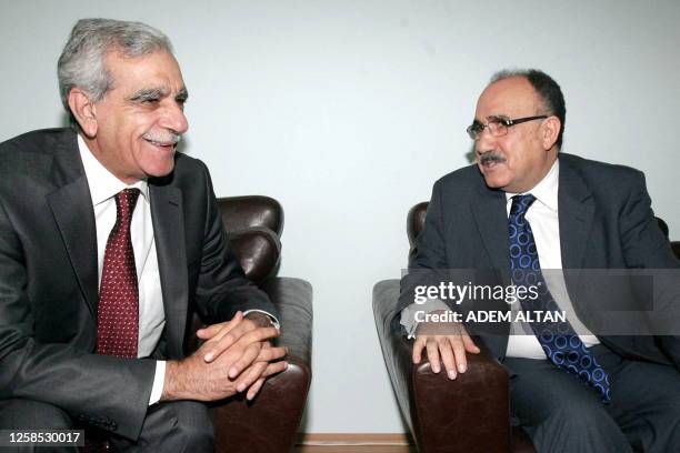 Turkish Interior Minister Besir Atalay, and Ahmet Turk, leader of the Democratic Society Party chat before their meeting in Ankara on August 13, 2009...