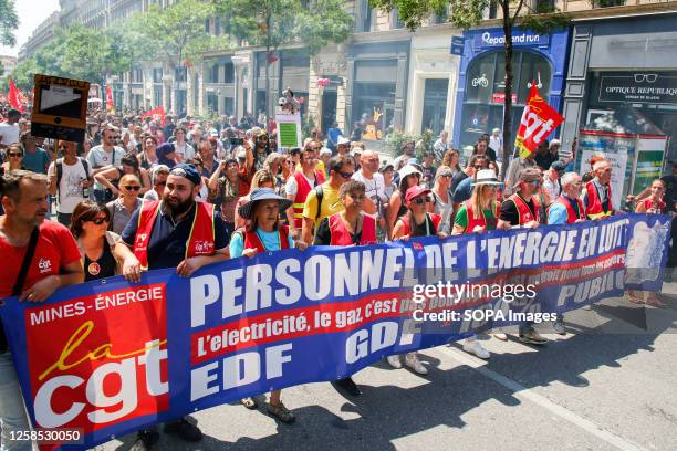 Protesters from the CGT union march with a banner during a demonstration against pension reform. French unions have called for a 14th day of action...
