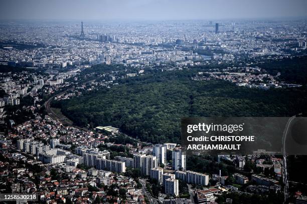 This picture taken on June 7 shows the Paris skyline with the Eiffel tower and the Montparnasse tower lined up during a reconnaissance flight onboard...