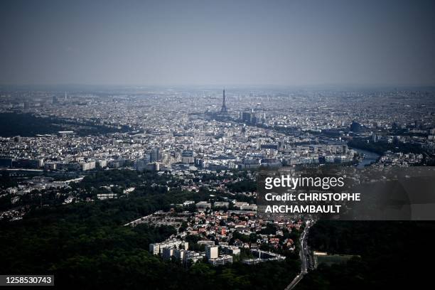 This picture taken on June 7 shows the Paris skyline with the Eiffel tower lined up during a reconnaissance flight onboard a French army Fennec...