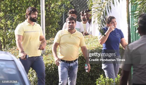 Wrestler Sakshi Malik with husband Satyawart Kadian and others arrive for a meeting with Union Minister for Sports and Youth Affairs Anurag Thakur,...