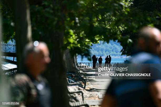 Security personnel gather in Annecy, south-eastern France on June 8 following a mass stabbing in the French Alpine town. Seven people, including six...