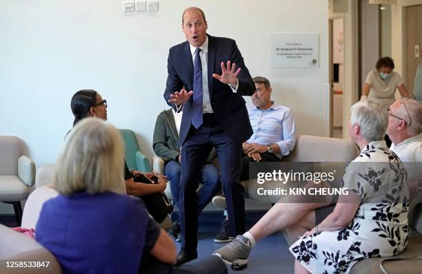 Britain's Prince William, Prince of Wales talks with outpatients as he visits The Royal Marsden NHS Foundation Trust's Oak Cancer Centre, in Sutton,...