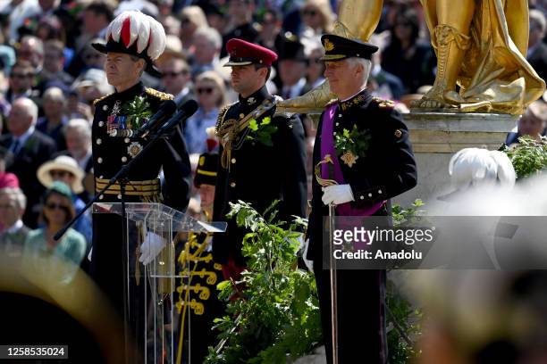 King Philippe of Belgium salutes as Chelsea Pensioners parade on Founders Day at the Royal Hospital Chelsea on June 8, 2023 in London, England.