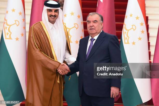 Emir of Qatar Sheikh Tamim bin Hamad Al Thani poses for a photo the President of Tajikistan Imamali Rahman at the Presidential Palace in Dushanbe,...