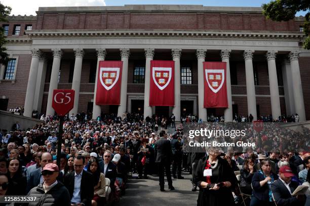 Cambridge, MA Guests watch the 372nd Commencement at Harvard University. Harvard granted degrees to 9,110 graduates.
