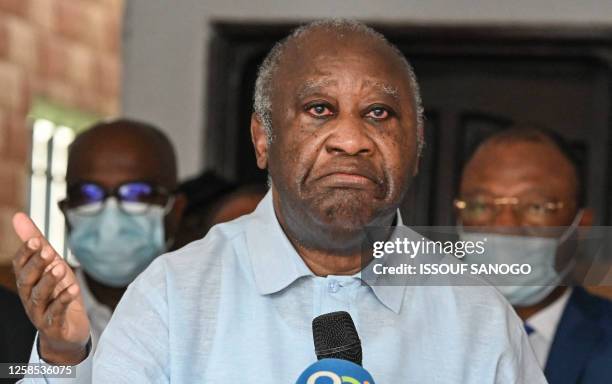 Former Ivory Coast president Laurent Gbagbo, reacts as he speaks near the Ivory Coast Independent Electoral Commission offices in Angre, Abidjan, on...