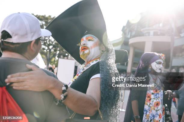 The Sisters of Perpetual Indulgence interact with fans during Pride night at the Angels versus Cubs game at the Angels Stadium on Wednesday, June 7,...