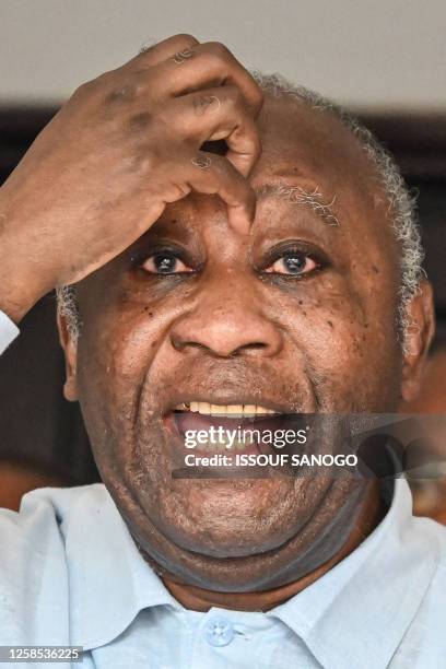 Former Ivory Coast president Laurent Gbagbo, gstures as he speaks near the Ivory Coast Independent Electoral Commission offices in Angre, Abidjan, on...