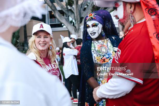 Anaheim Mayor Ashleigh Aitken chats with The Sisters of Perpetual Indulgence interact with fans during Pride night at the Angels versus Cubs game at...