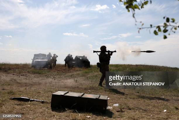 Ukrainian serviceman fires a rocket launcher during a military training exercise not far from front line in Donetsk region on June 8, 2023.