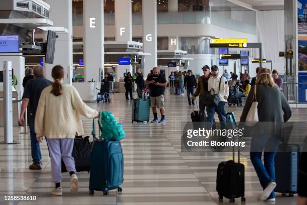 Travelers at LaGuardia Airport in the Queens borough of New York, US, on Thursday, June 8, 2023. The Federal Aviation Administration said LaGuardia...