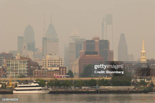 Buildings in the Philadelphia skyline shrouded in smoke from Canada wildfires in Camden, New Jersey, US, on Thursday, June 8, 2023. The US Northeast...