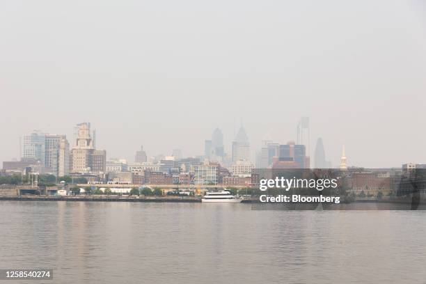 Buildings in the Philadelphia skyline shrouded in smoke from Canada wildfires in Camden, New Jersey, US, on Thursday, June 8, 2023. The US Northeast...