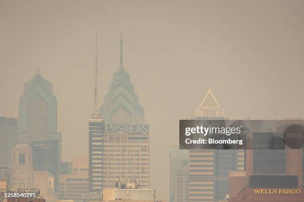 Buildings in the Philadelphia skyline shrouded in smoke from Canada wildfires in Camden, New Jersey, US, on Thursday, June 8, 2023. The US Northeast...