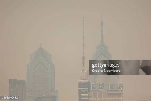 Buildings in the Philadelphia skyline shrouded in smoke from Canada wildfires in Camden, New Jersey, US, on Thursday, June 8, 2023. The US Northeast...