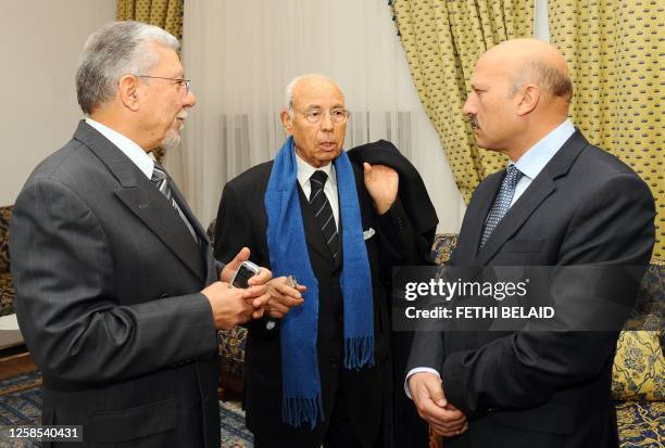 Tunisian Education Minister Taieb Baccouche speaks with Tunisian Justice Minister Lazhar Karoui Chebbi and Tunisian Secretary of State Ridha Belhaj...